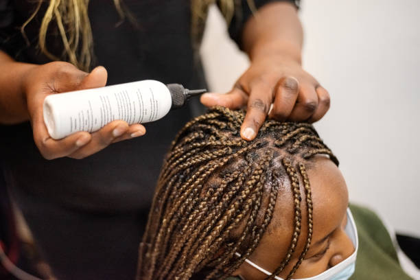 Maintaining knotless braids in Houston with satin scarf and hair
