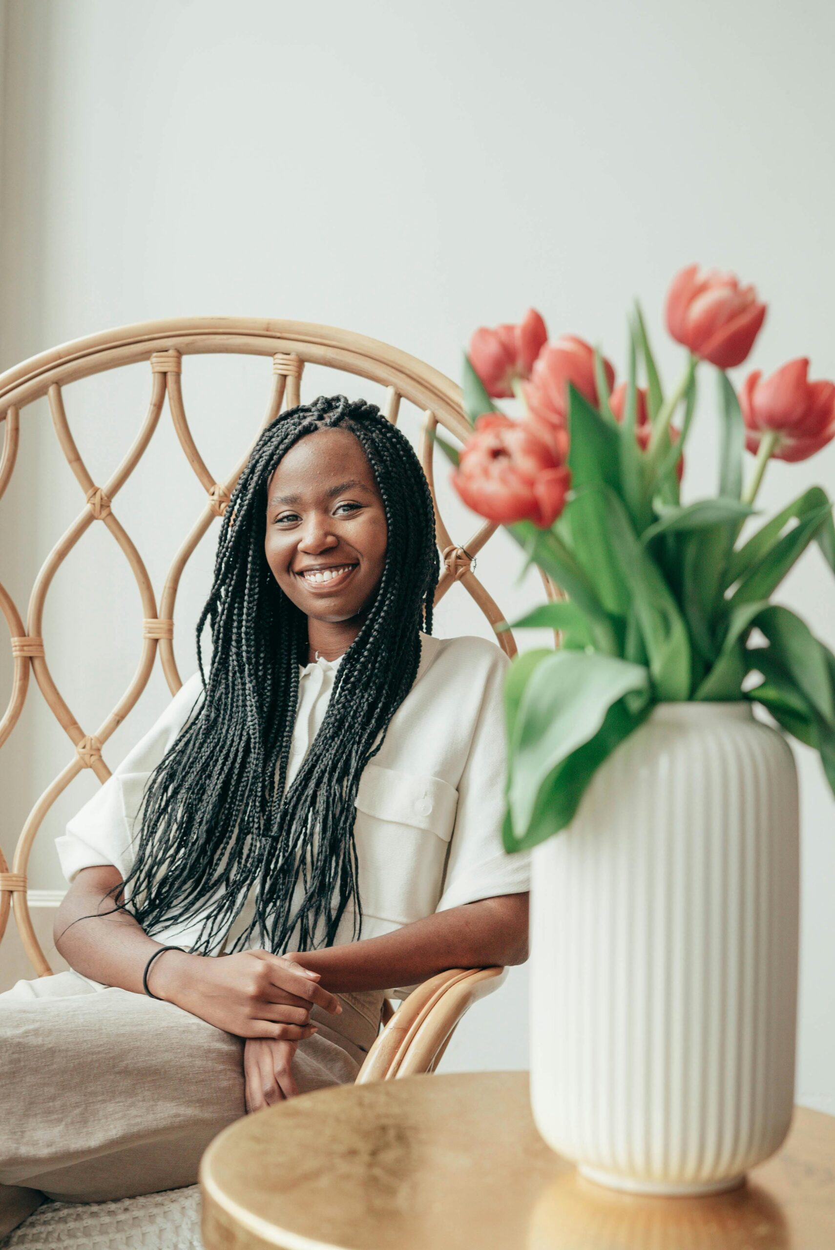 Houston woman smiling with beautiful braids before and after braids transformation