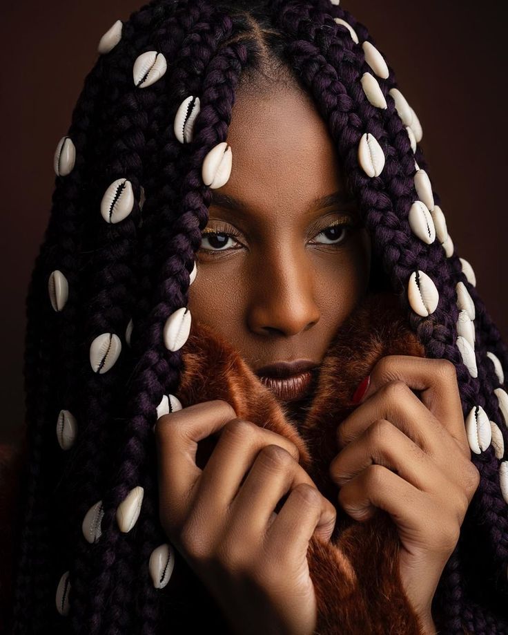 African hair braiding cultural significance box braids in Newark NJ